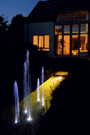 Illuminated LED nozzles highlight the dancing water display.